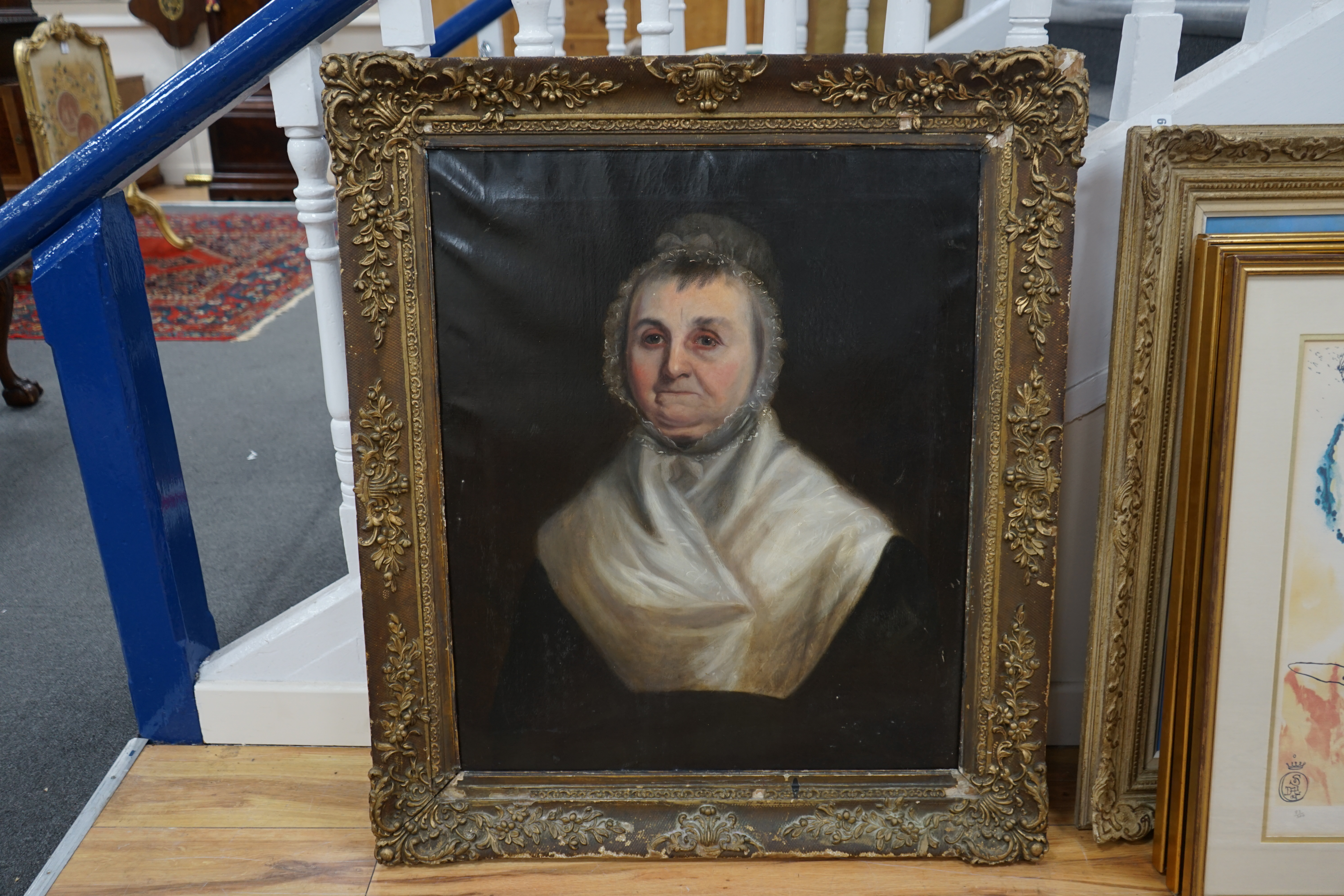 Late 18th / early 19th century English School, oil on canvas, Head and shoulders portrait of an elderly lady wearing a bonnet, unsigned, 74 x 62cm, label verso, ornately framed. Condition - fair, original canvas sagging